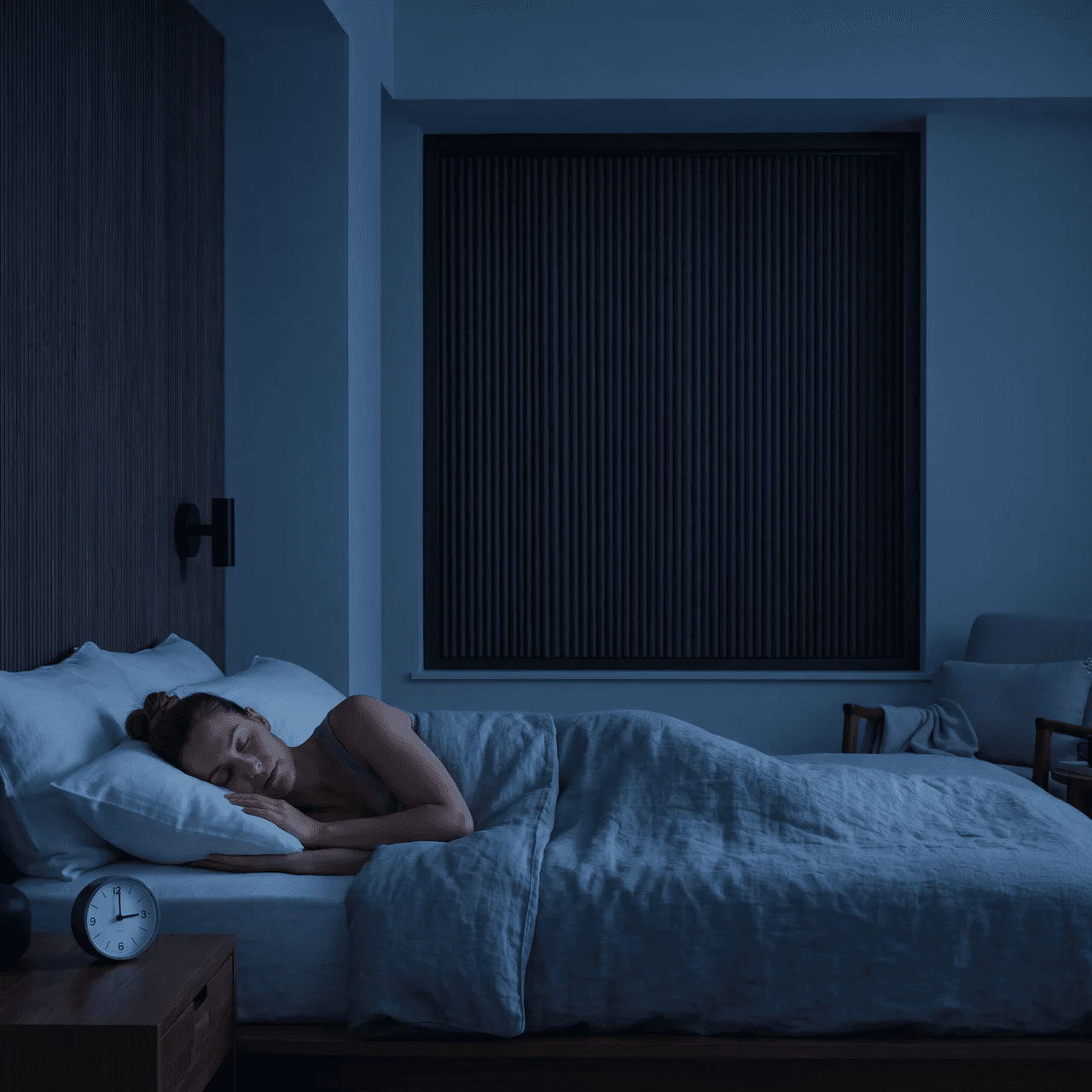 OneRest blackout blind creating a dark, sleep-ready bedroom