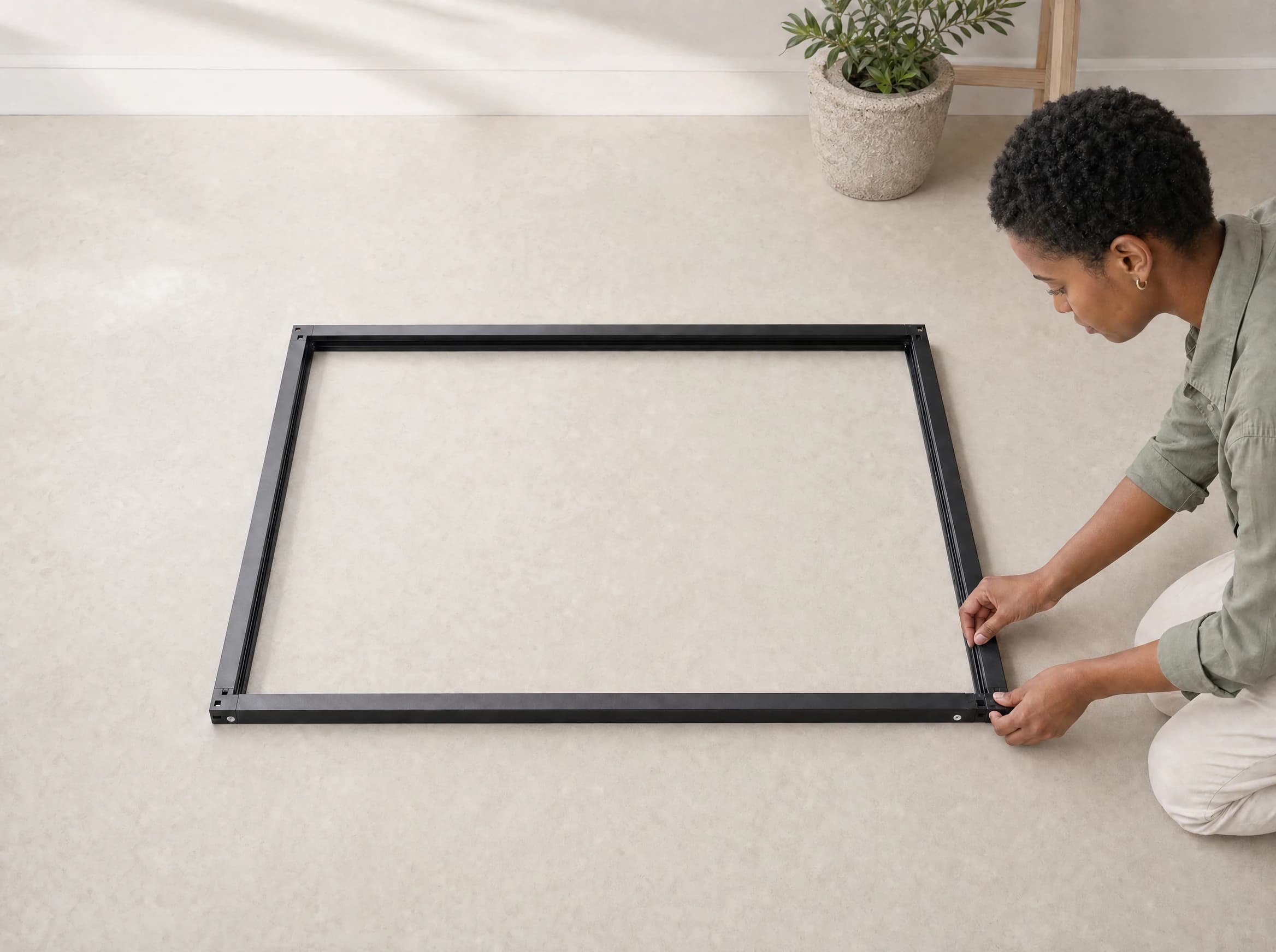 OneRest blackout blind frame profiles laid out on a flat surface before assembly