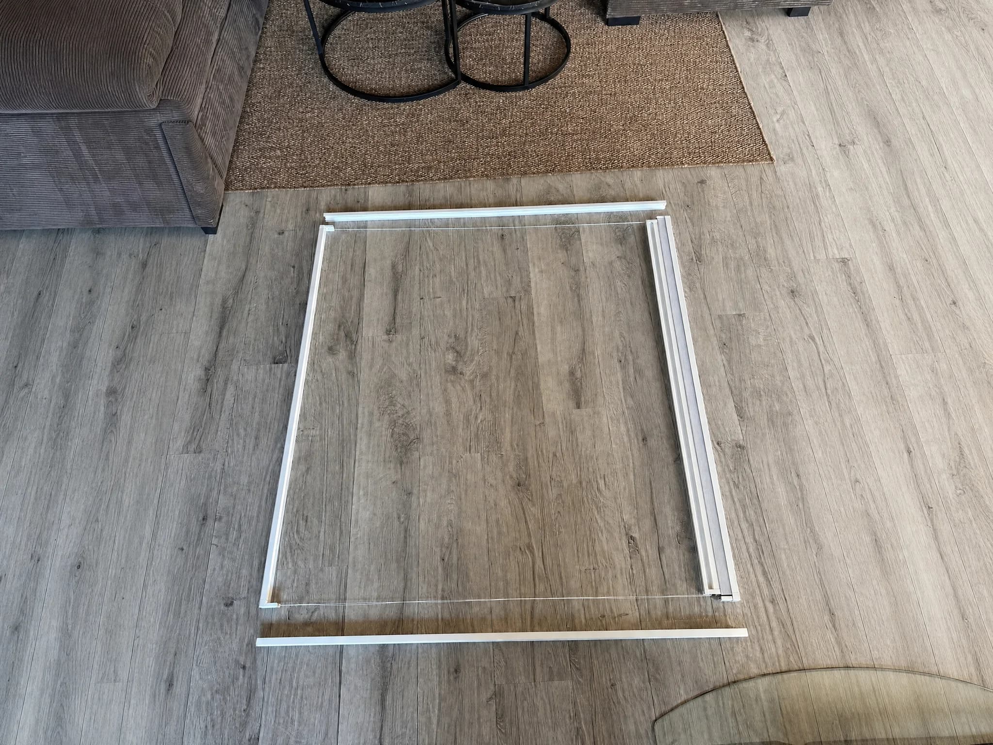 OneRest blackout blind frame profiles laid out on a flat surface before assembly